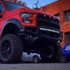 The red face of the 6x6 RaptorBus E-series overland mod