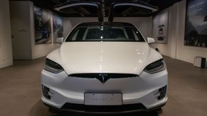 A white Tesla Model 3 on display