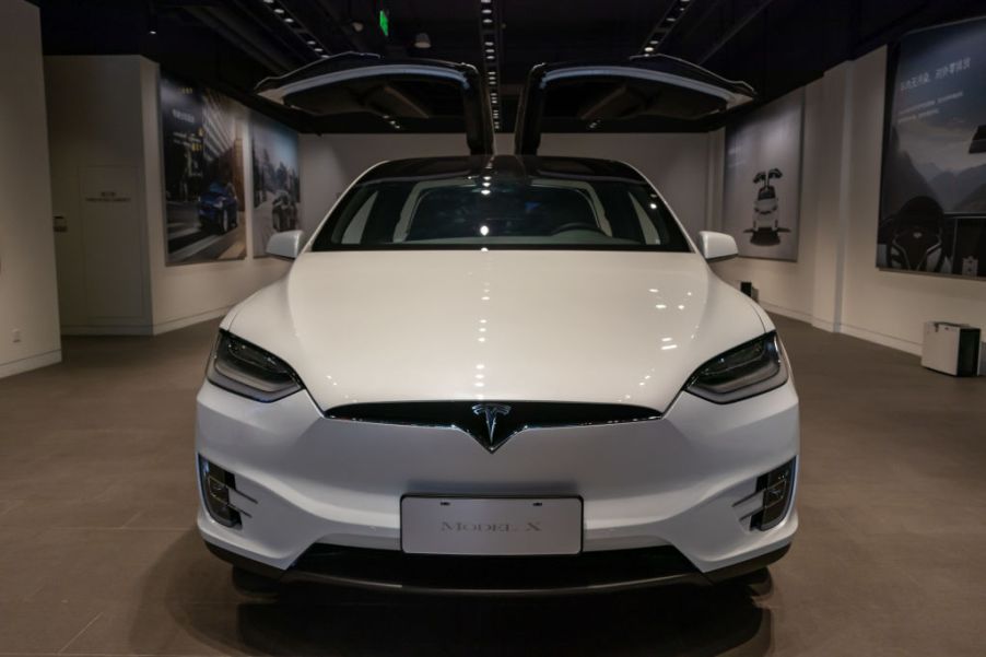 A white Tesla Model 3 on display