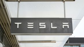 A Tesla sign seen outside a storefront