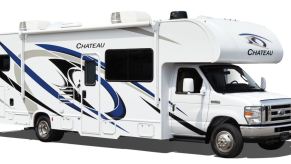 A white RV camper (Class C) owned by Thor industries