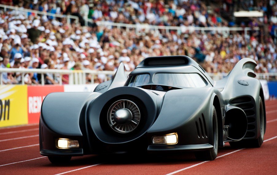 A Batmobile replica enters a stadium