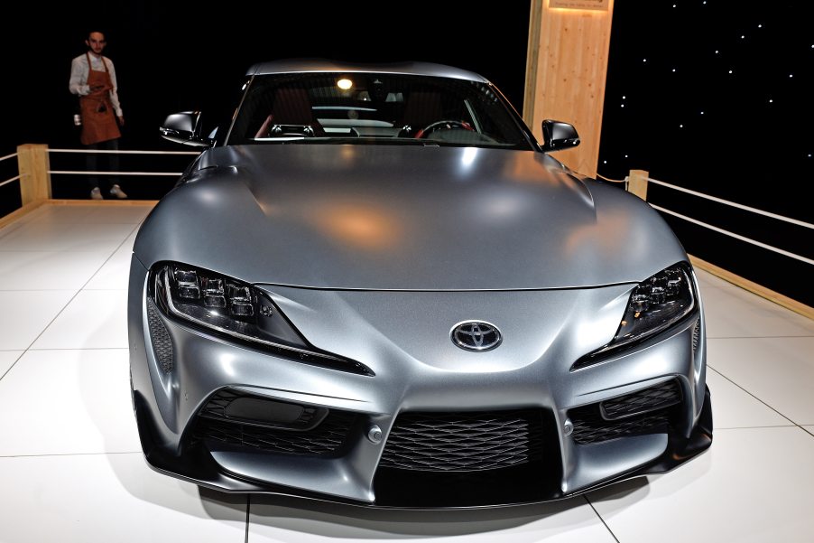 A titanium colored Supra sits on display at a car show