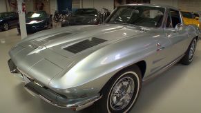 A silver 1963 Corvette Sting Ray Split-Window Coupe in a garage