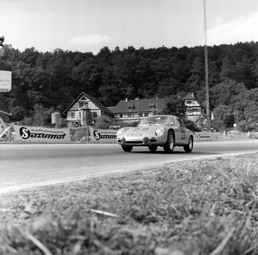 Black-and-white photo of the 1963 Porsche 356 Carrera GTL Abarth driving on a racetrack