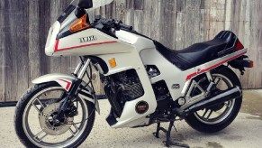 White 1983 Yamaha XJ650 Seca Turbo in front of a fence