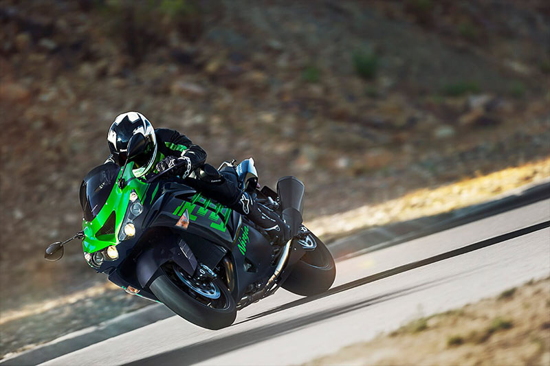 a sparkly green ninja zx-14r raging down the road at high speed