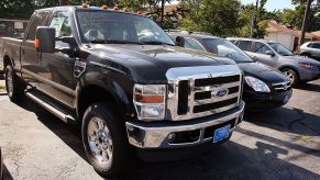 A 2008 Ford F-250 sitting at a car dealership