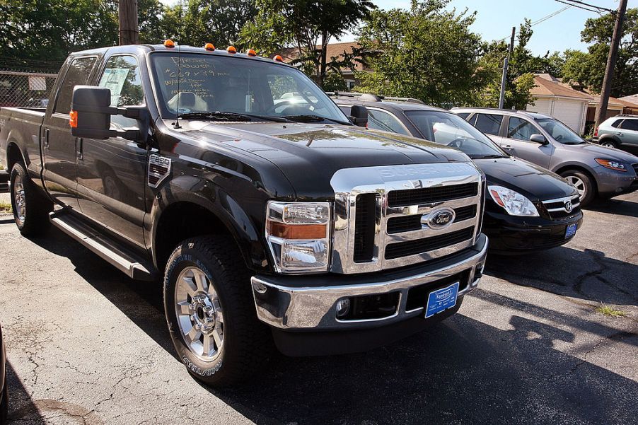 A 2008 Ford F-250 sitting at a car dealership