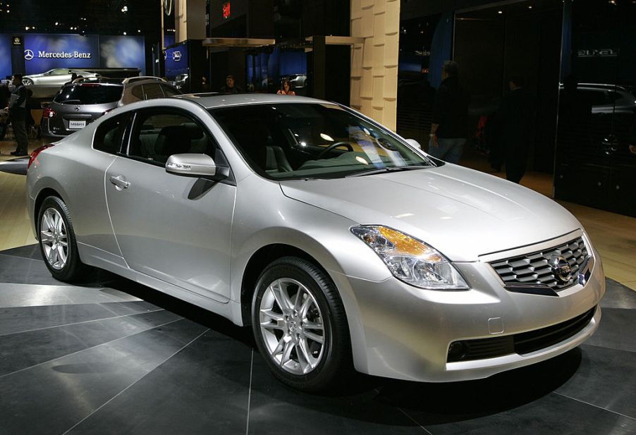 A Nissan Altima on display at an auto show