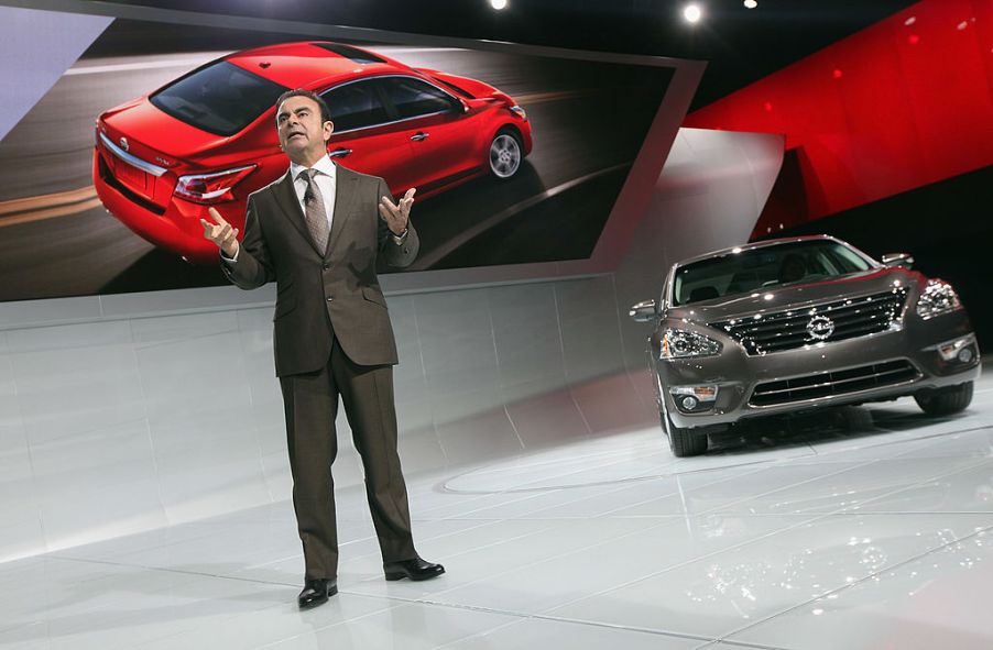 The 2013 Nissan Altima being introduced at an auto show