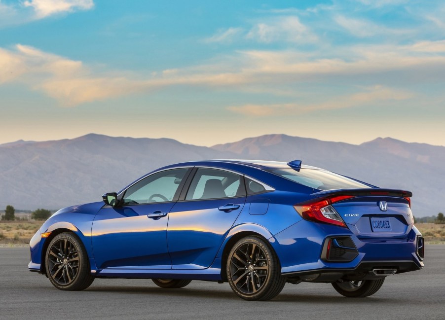 Rear side view of a blue 2020 Honda Civic Si Sedan