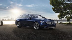 Dark blue 2020 Mercedes E450 4Matic Wagon parked in front of a city