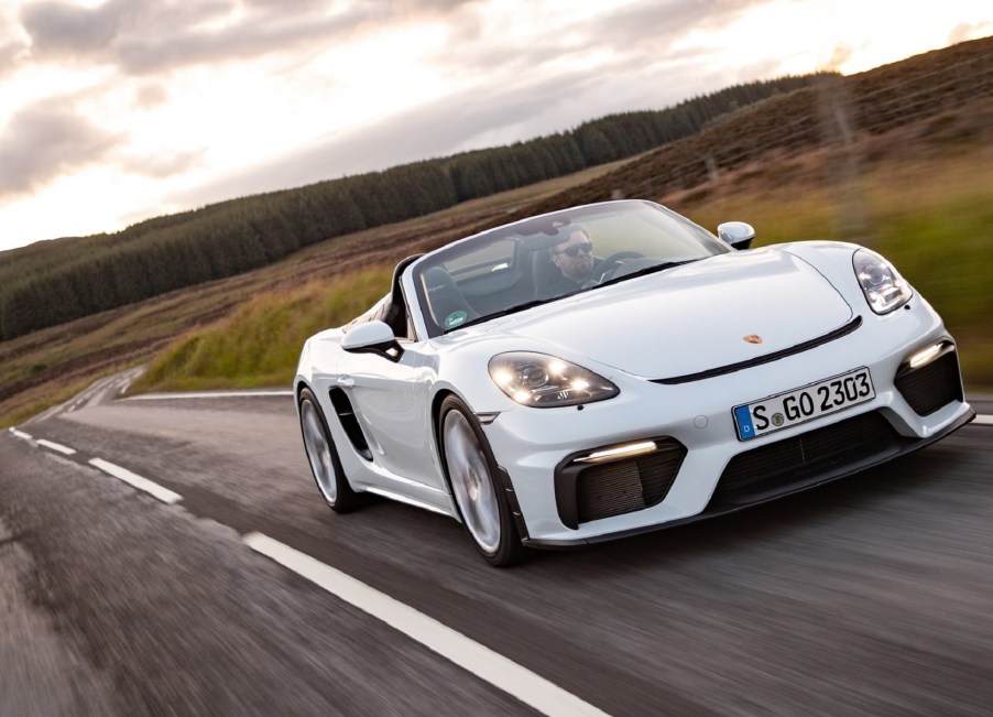 White 2020 Porsche 718 Spyder being driven down a curvy road