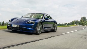 Blue 2020 Porsche Taycan Turbo driving down the road