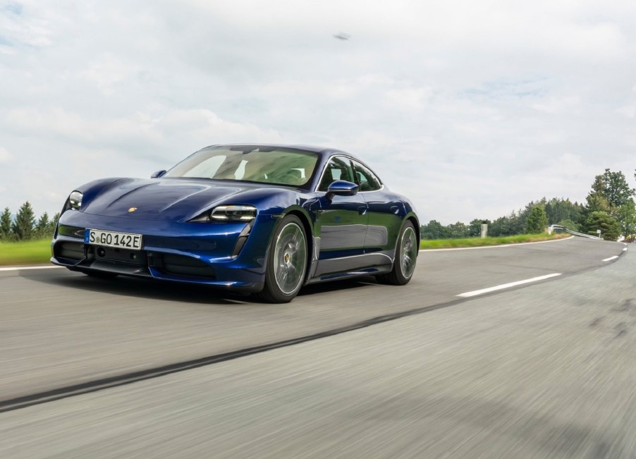 Blue 2020 Porsche Taycan Turbo driving down the road