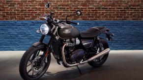 Gray 2020 Triumph Street Twin parked in front of a brick wall