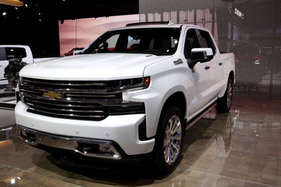 A white 2020 Chevy Silverado on display at an auto show