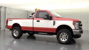 red and white 2020 F250 Super Duty highboy package side view lifted