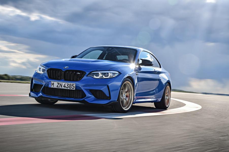 A blue 2021 BMW M2 CS taking a tight track corner