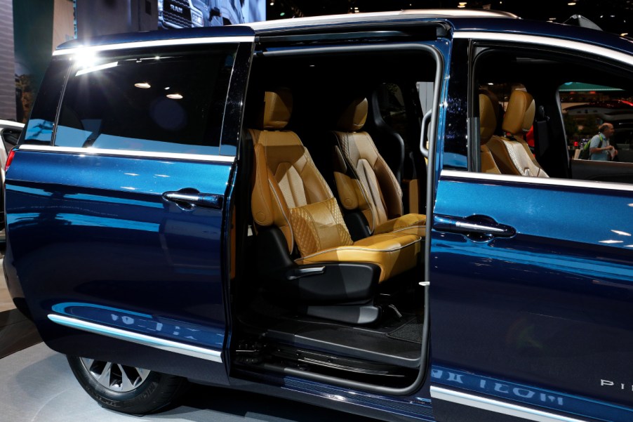 A blue 2021 Chrysler Pacifica on display at an auto show