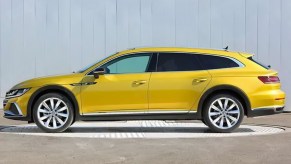 Yellow 2021 VW Arteon Shooting Brake wagon side view