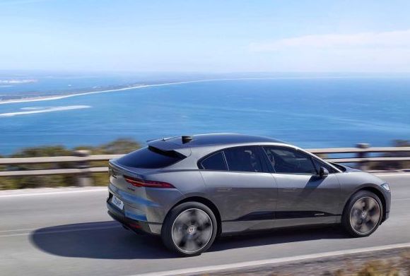 2021 Jaguar I-Pace rounding a hill rear 3/4 view