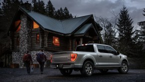 2021 Ford F-150 parked in front of cabin