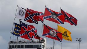 Confederate and American flags waving at NASCAR event at Darlington