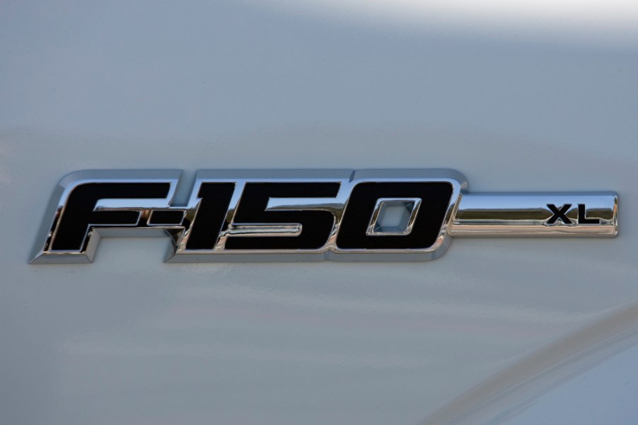 A Ford F-150 logo on a white truck