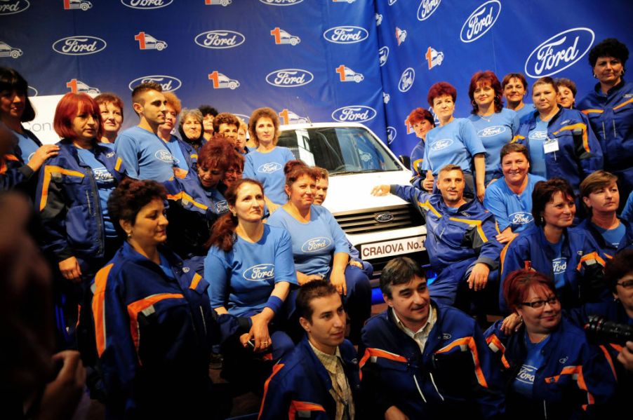 Ford workers in Romania pose with Transit van