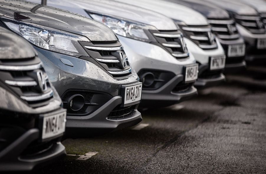 A row of Honda cars at a dealership