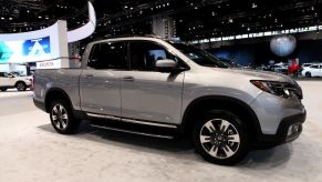 A silver 2020 Honda Ridgeline on display at an auto show