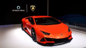 A red Lambo sits on display at an electronics show