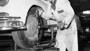 Mechanic performing a wheel alignment