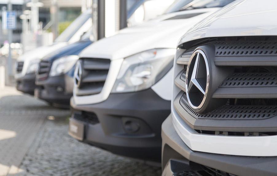 Mercedes-Benz Sprinter vans parked in a dealership parking lot.