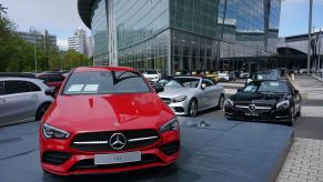 Cars stand on display for sale at a Mercedes-Benz dealership during the coronavirus crisis