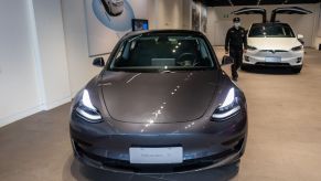 A Tesla Model 3 car and a Tesla Model X vehicle are seen at the first Tesla Center in Shanghai