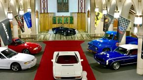 Cars are parked inside an old church