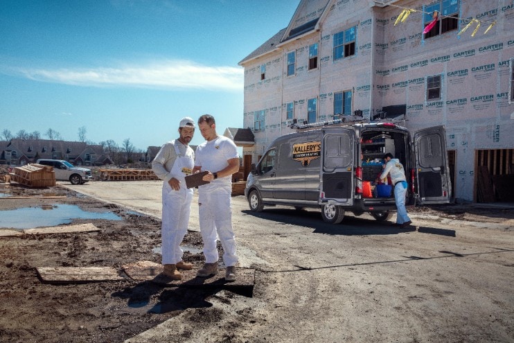 A brown 2020 Ford Transit Cargo van on a construction jobsite