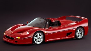 A red 1995 Ferrari F50 with its targa roof off