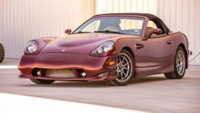 A burgundy-red 2004 Panoz Esperante GTLM Roadster