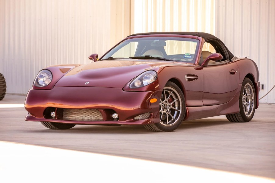 A burgundy-red 2004 Panoz Esperante GTLM Roadster