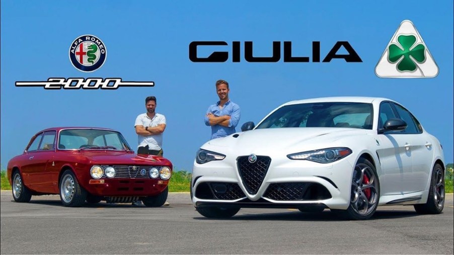 A white 2020 Alfa Romeo Giulia Quadrifoglio in front of a red 1973 Alfa Romeo 2000 GTV