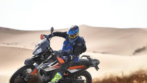 Black-and-orange 2020 KTM 790 Adventure R power-sliding through the desert