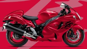 A red 2020 Suzuki Hayabusa against a lighter-red 'Hayabusa' kanji background