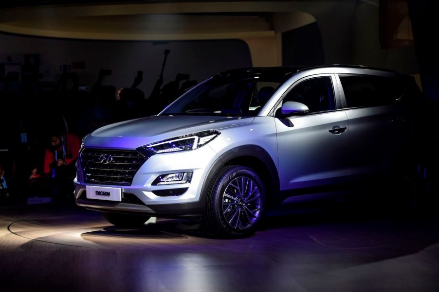 A silver 2020 Tucson is displayed on stage after its launch at the Auto Expo 2020