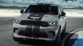 A gray Dodge Durango sits on the turn at a track.