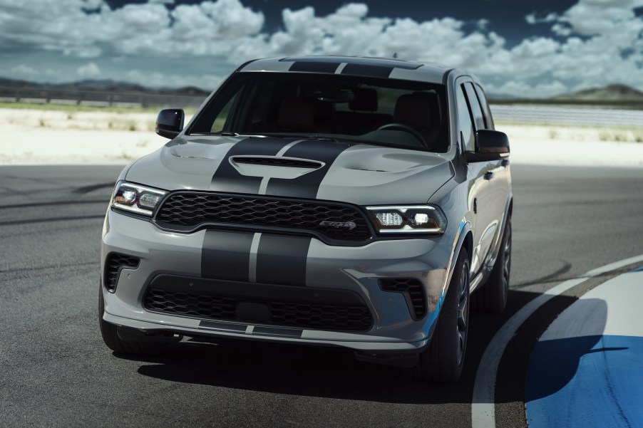 A gray Dodge Durango sits on the turn at a track.