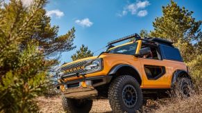 A yellow two-door Ford Bronco